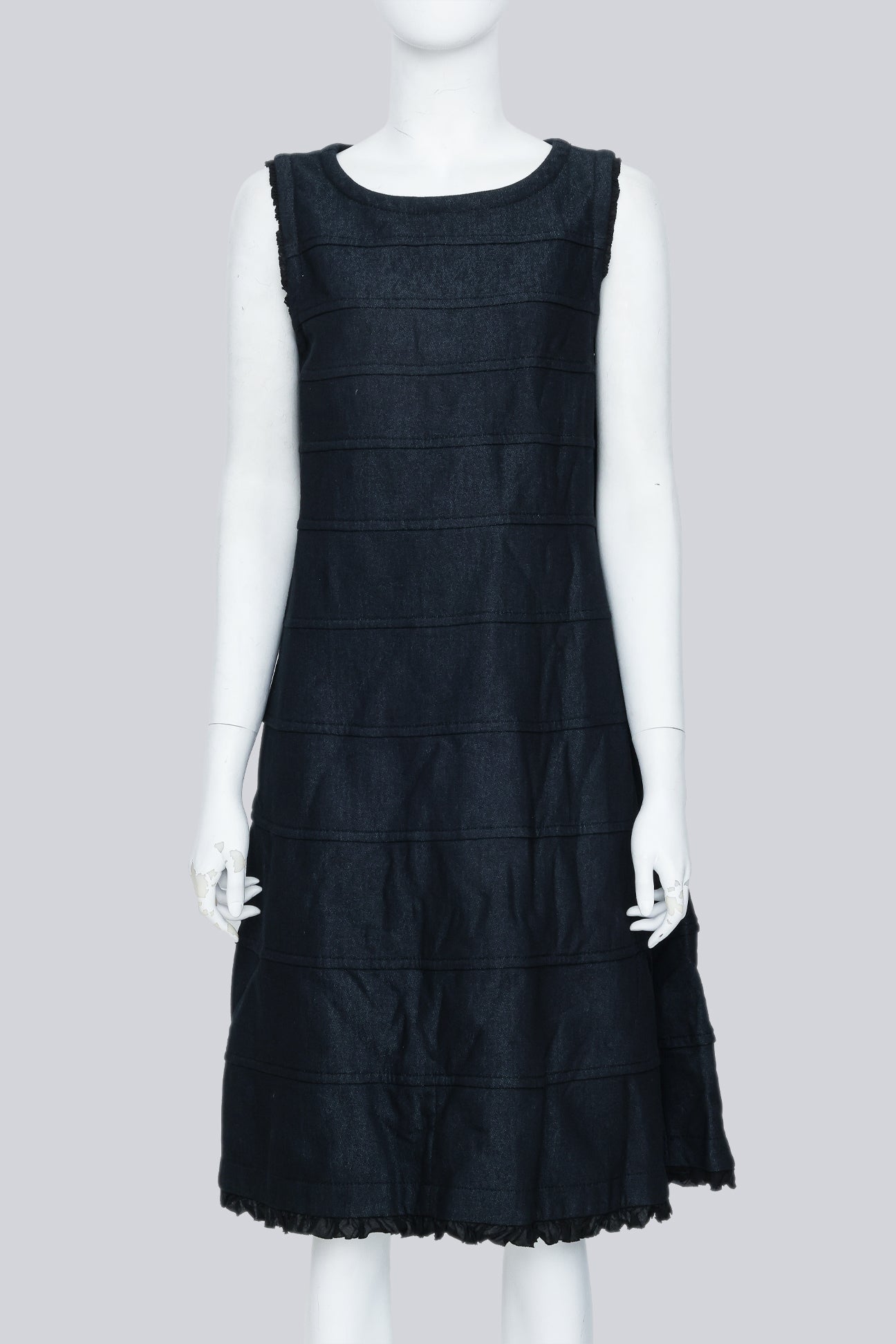 COMME DES GARÇONS TRICOT - A SLEEVELESS BLACK PANELLED DRESS WITH RUFFLED TRIM