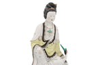 A POLYCHROME-ENAMELLED PORCELAIN FIGURE OF A WOMAN AND BIRD