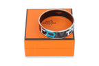 HERMÈS - A 'CAPITALES' ENAMEL BANGLE