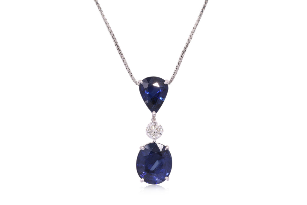 A BLUE SAPPHIRE AND DIAMOND PENDANT ON CHAIN