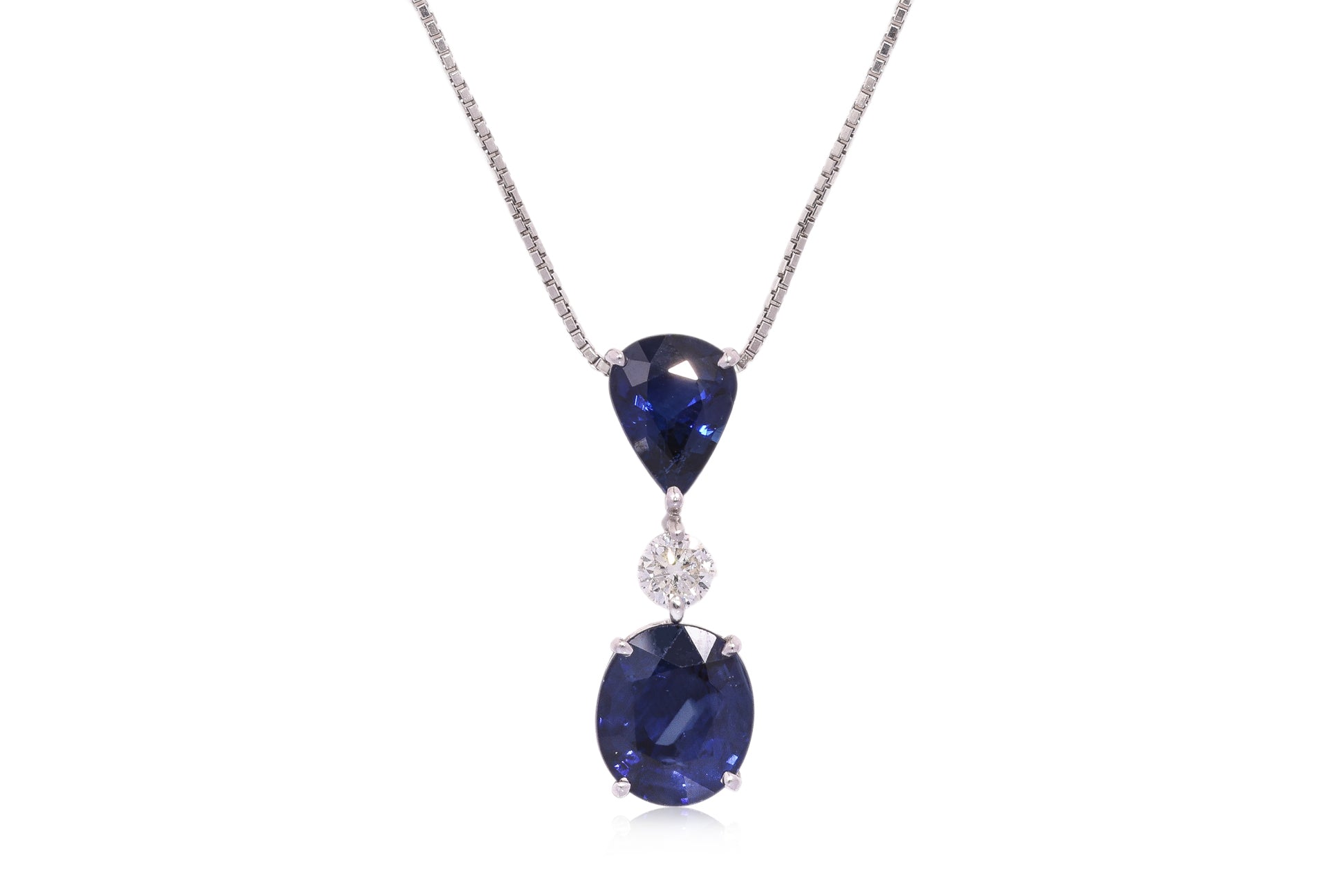 A BLUE SAPPHIRE AND DIAMOND PENDANT ON CHAIN