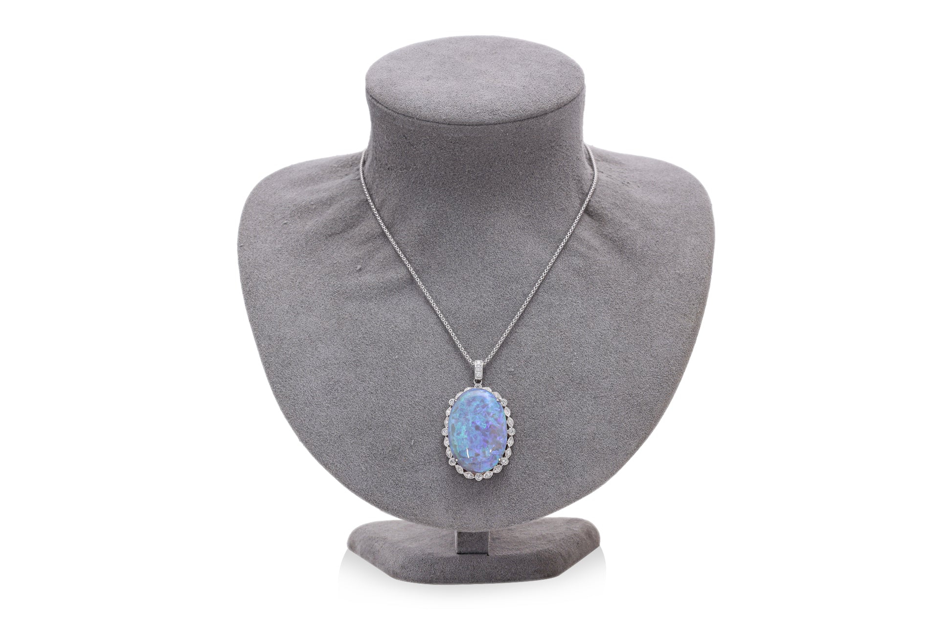 A LARGE OPAL AND DIAMOND PENDANT ON CHAIN