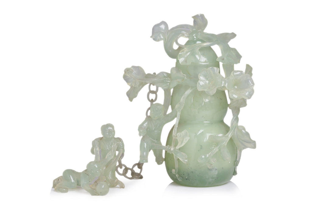 A SERPENTINE JADE DOUBLE GOURD VASE AND COVER