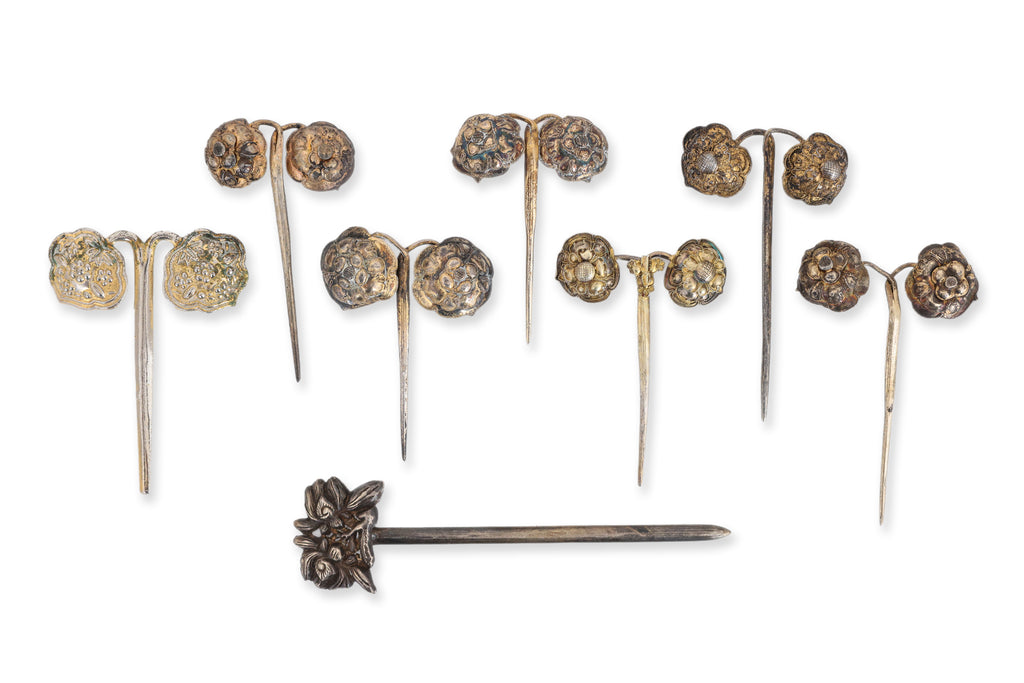 A GROUP OF EIGHT SILVER HAIR PINS