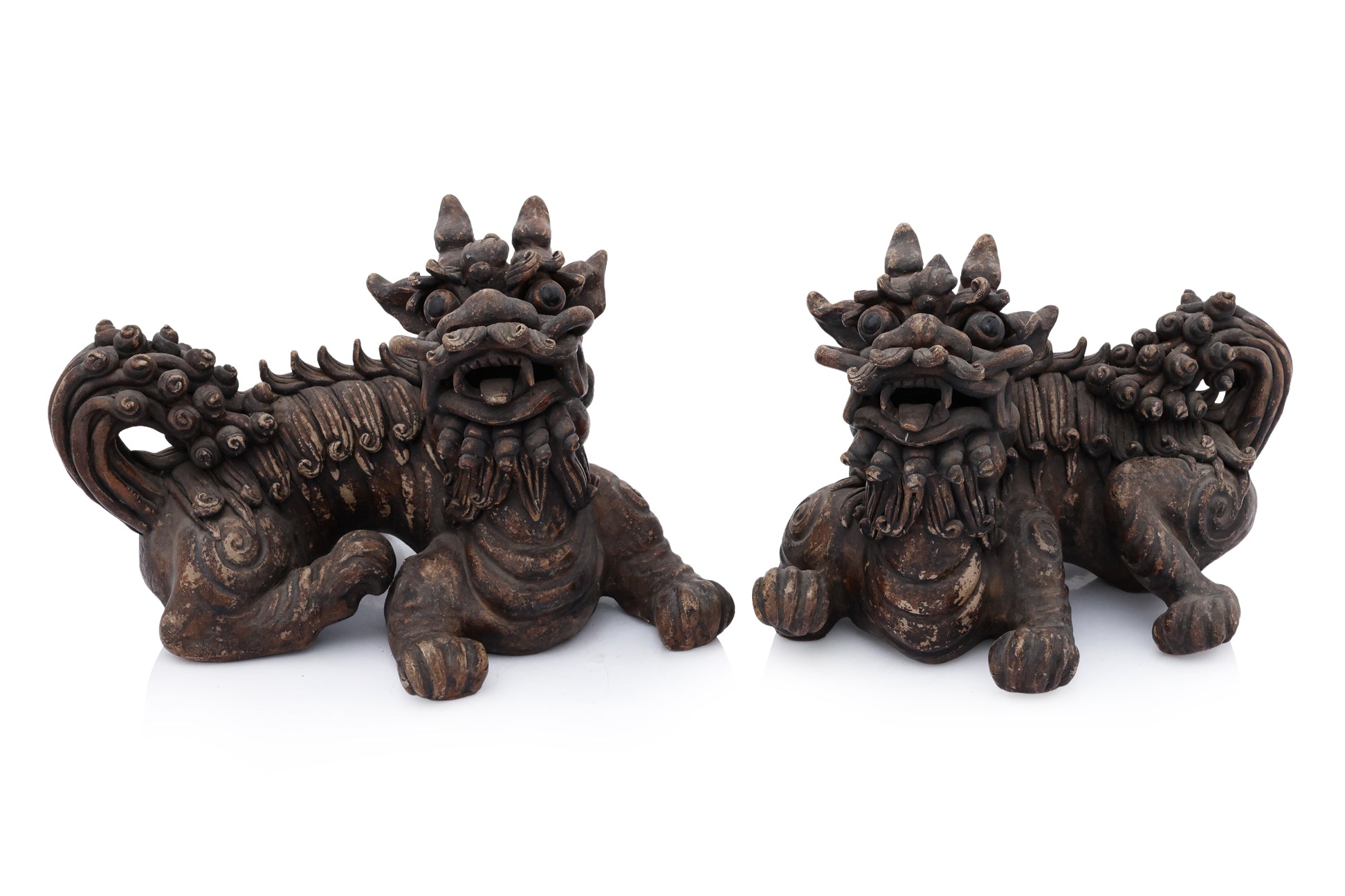 A PAIR OF SHIWAN POTTERY FOO LIONS