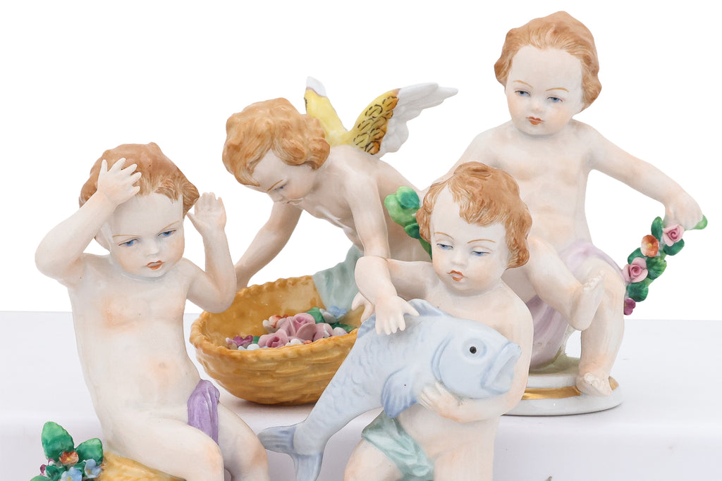 A GROUP OF EIGHT SITZENDORF PORCELAIN FIGURES OF PUTTI