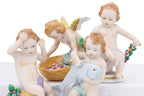 A GROUP OF EIGHT SITZENDORF PORCELAIN FIGURES OF PUTTI