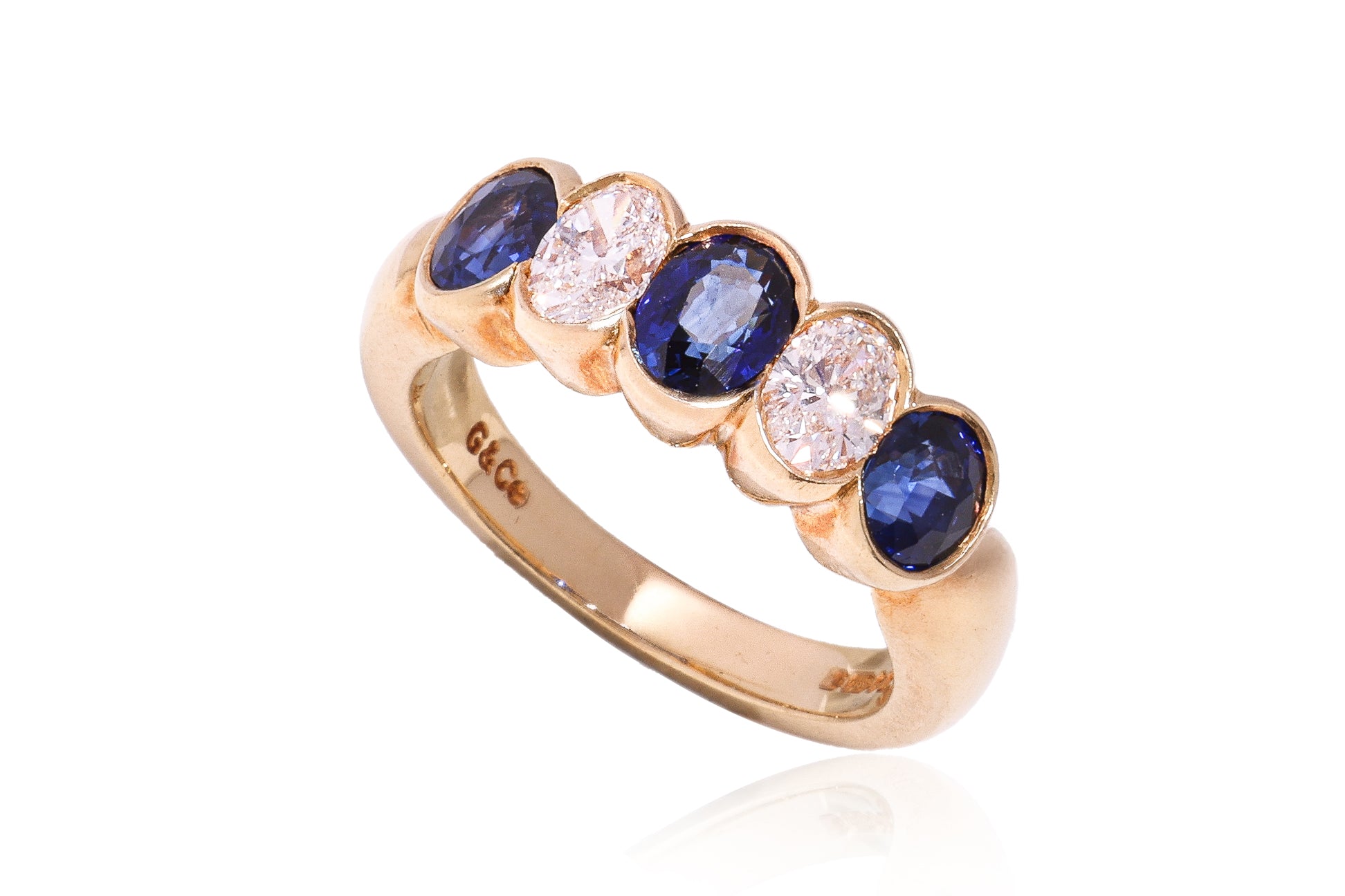 A SAPPHIRE AND DIAMOND FIVE STONE RING