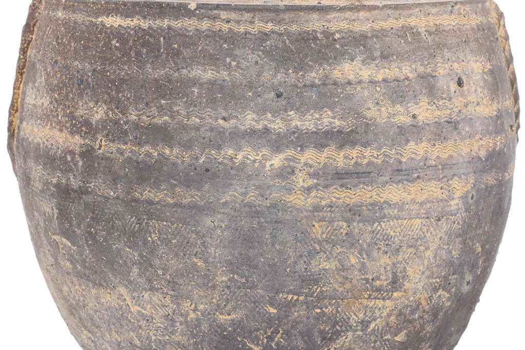 A DARK BROWN EARTHENWARE JAR