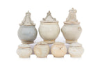 A GROUP OF QINGBAI-GLAZED JARS AND COVERS
