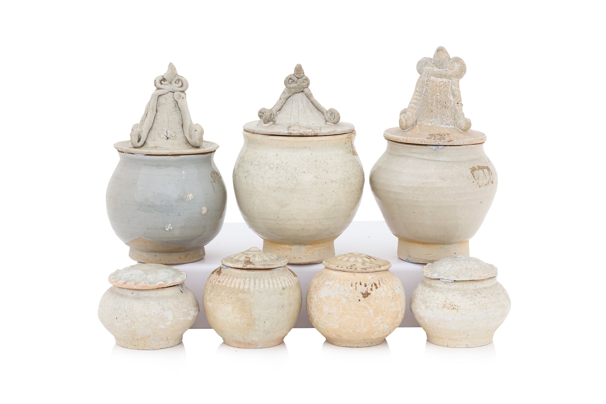 A GROUP OF QINGBAI-GLAZED JARS AND COVERS