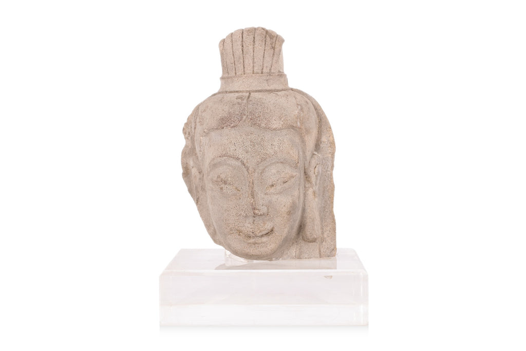 A STONE HEAD OF A BODHISATTVA