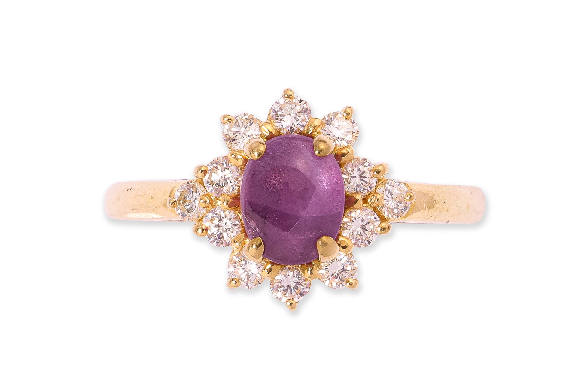 A STAR RUBY AND DIAMOND CLUSTER RING