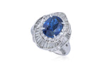 A SAPPHIRE AND DIAMOND CLUSTER RING