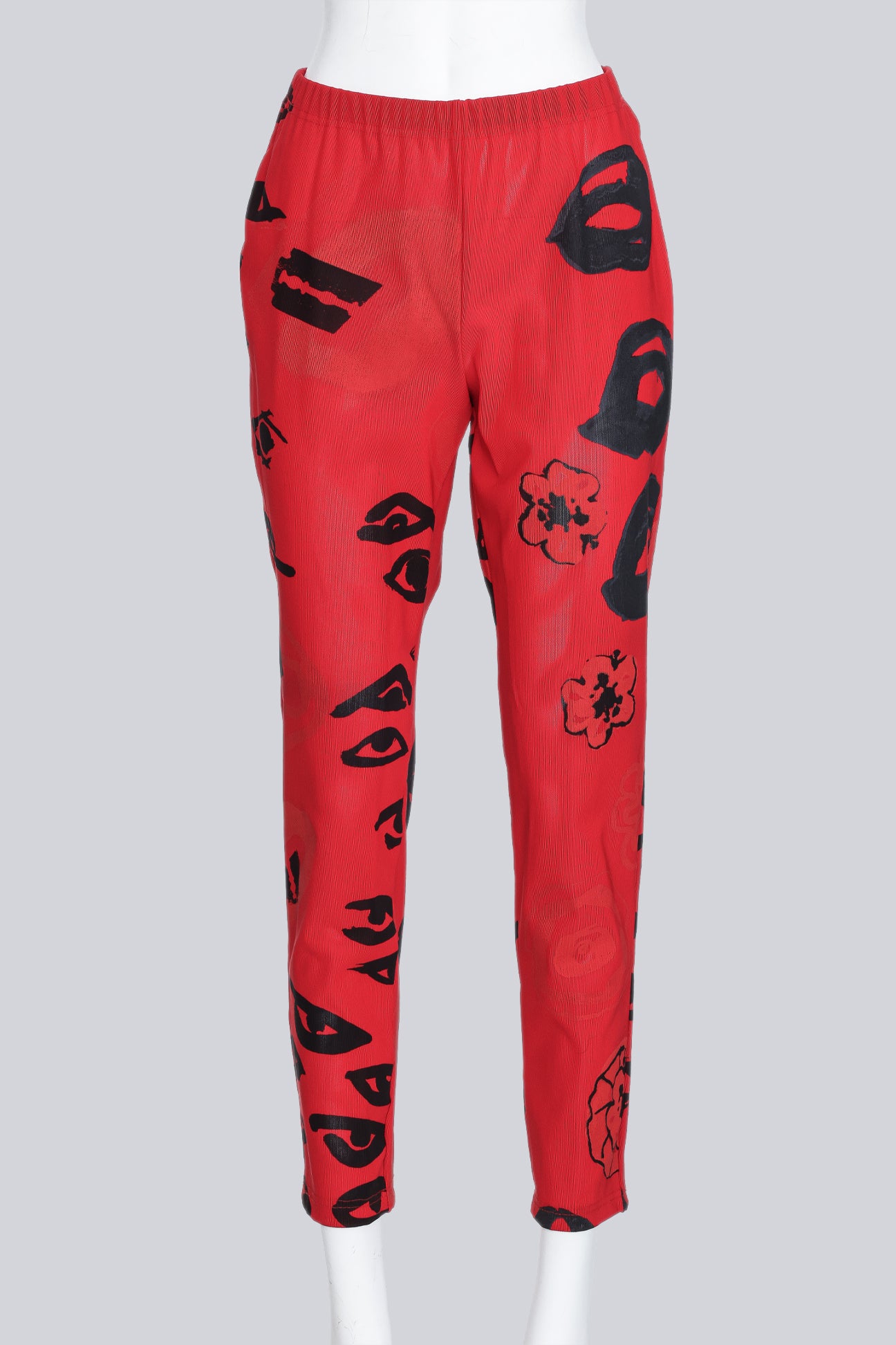 COMME DES GARCONS - A PAIR OF 2000 RED AND BLACK GRAPHIC PRINT PANTS