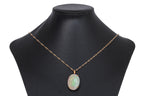 A LARGE OPAL PENDANT/BROOCH ON A CHAIN