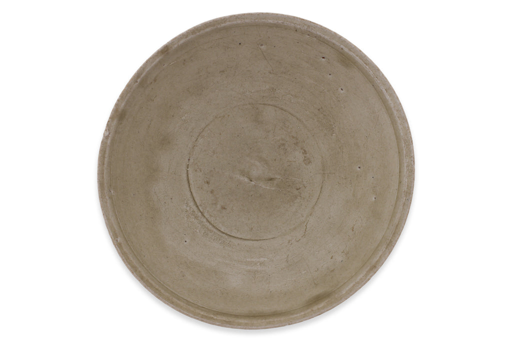 AN OLIVE-GLAZED STONEWARE BOWL