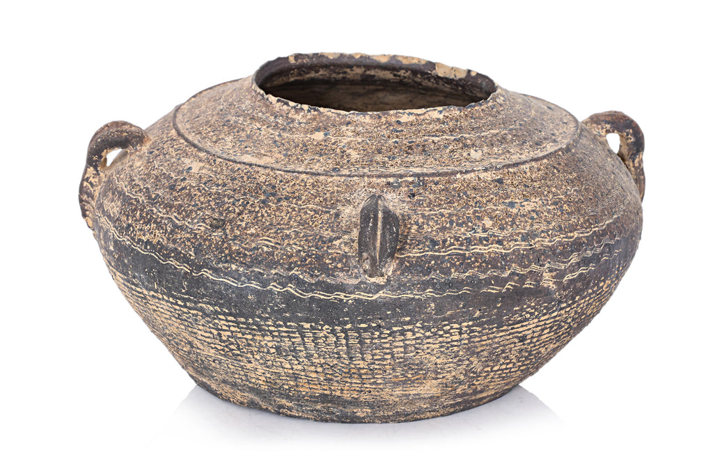 A DARK BROWN EARTHENWARE JAR