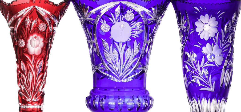 THREE LARGE COLOURED CUT TO CLEAR CRYSTAL VASES