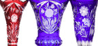 THREE LARGE COLOURED CUT TO CLEAR CRYSTAL VASES