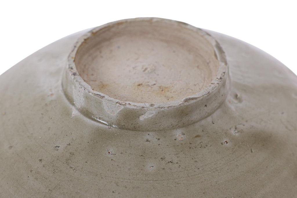 AN OLIVE-GLAZED STONEWARE BOWL