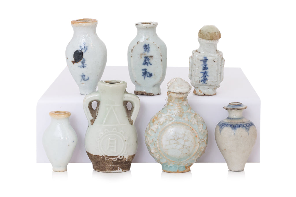 A GROUP OF SEVEN MINIATURE PORCELAIN BOTTLES