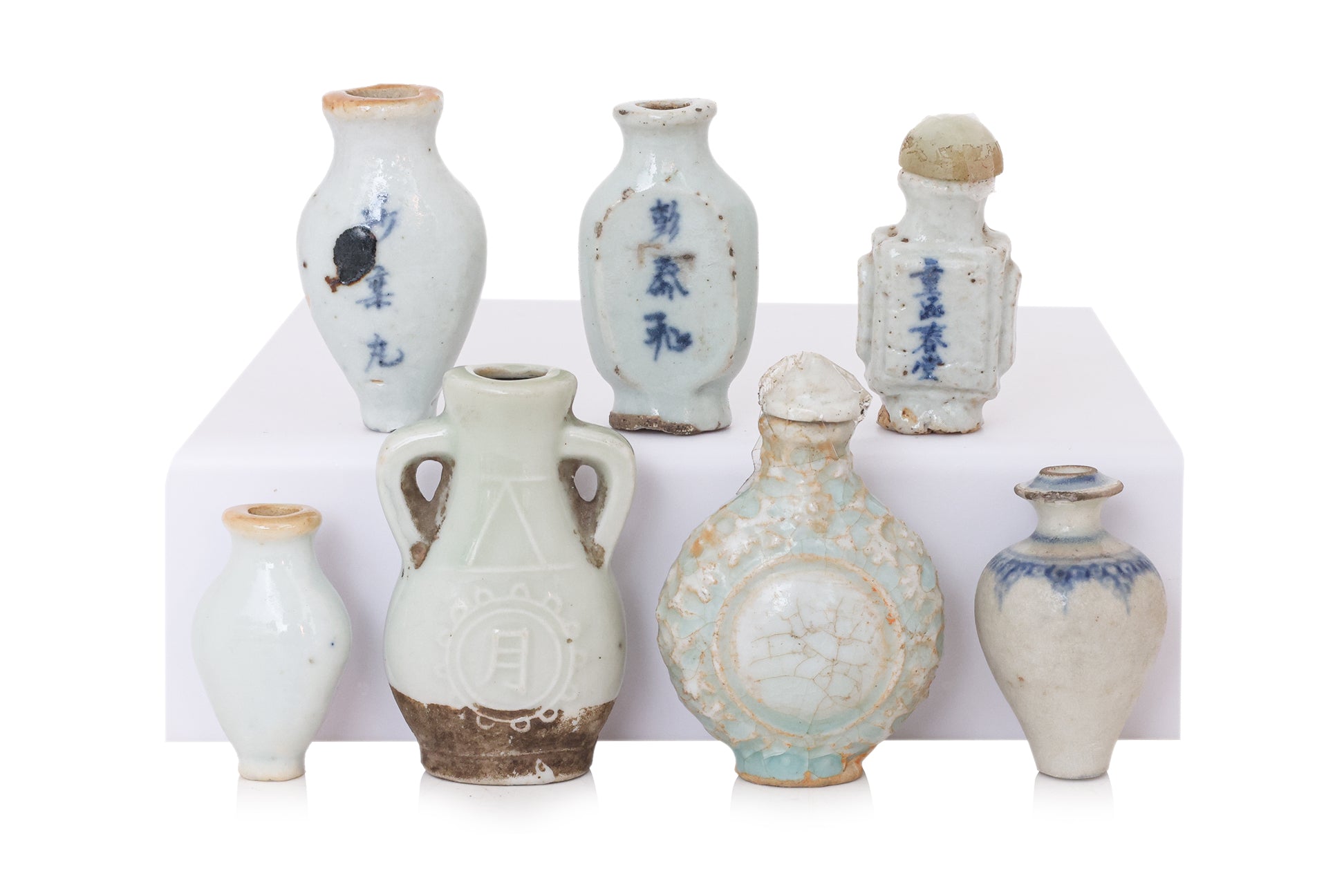A GROUP OF SEVEN MINIATURE PORCELAIN BOTTLES