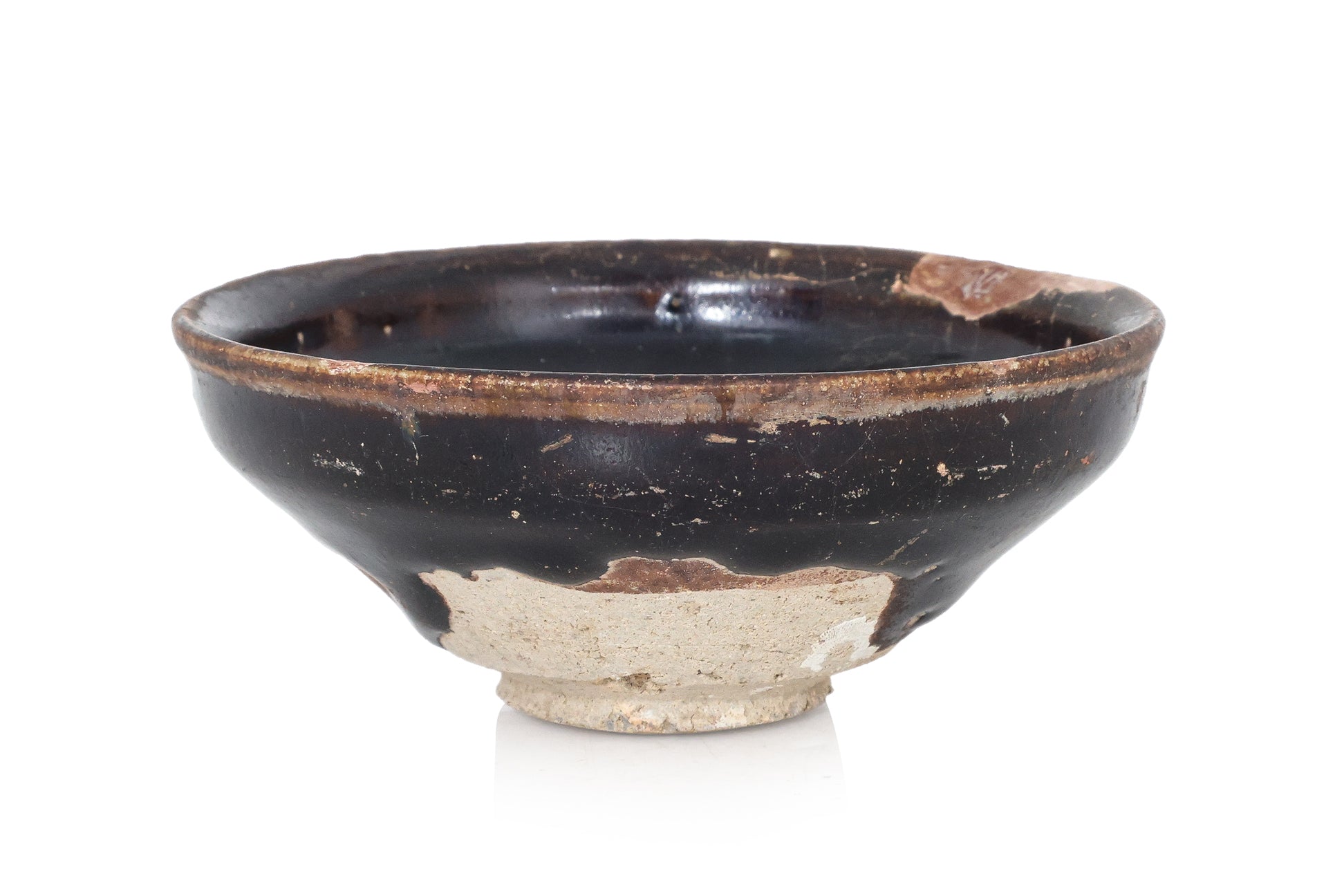A BLACK-GLAZED STONEWARE BOWL