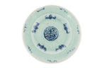 A BLUE AND WHITE 'SWEET PEA' BOWL AND COVER AND A CELADON 'SHOU' PLATE