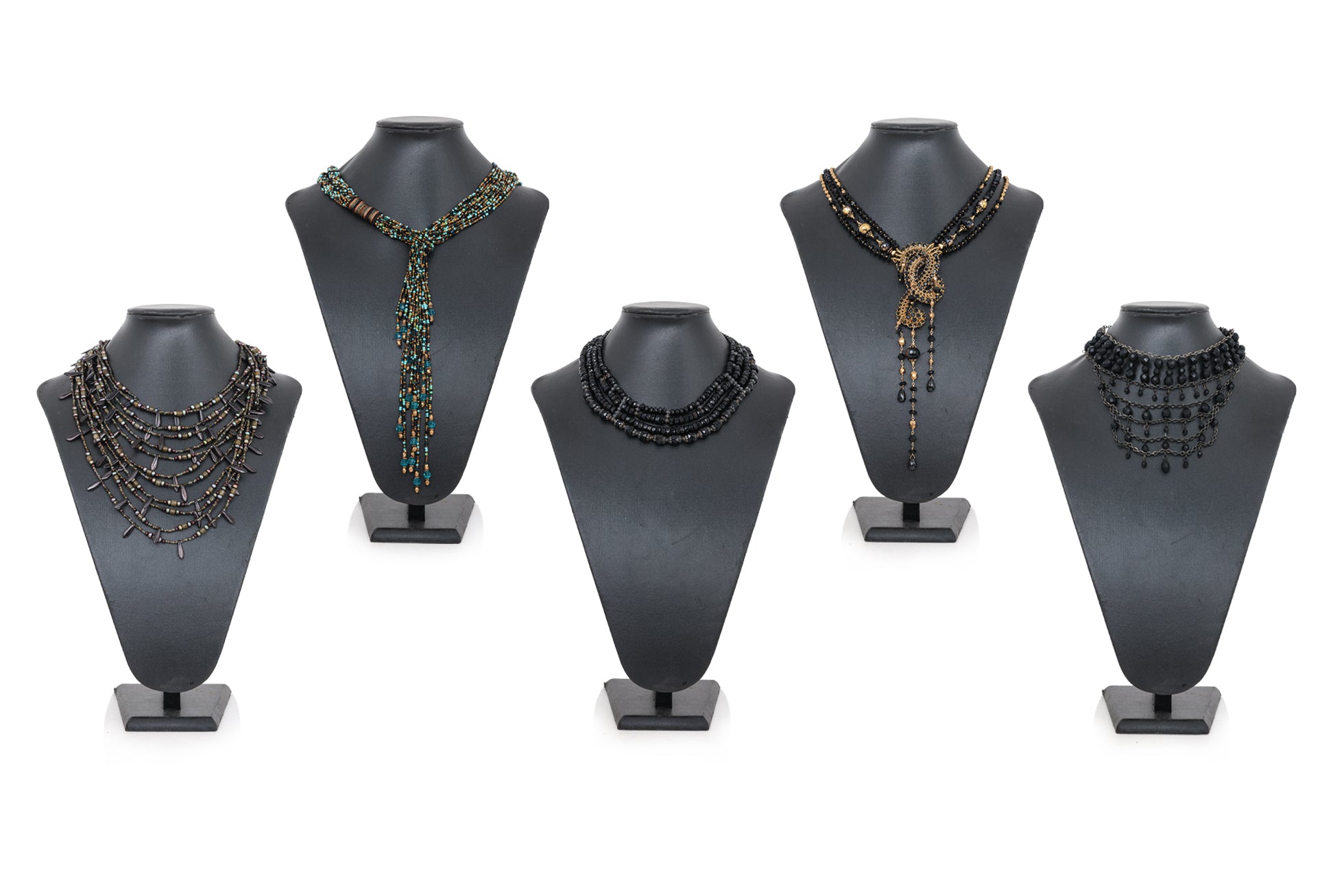 A GROUP OF FIVE COSTUME NECKLACES AND A SILVER TONED BANGLE