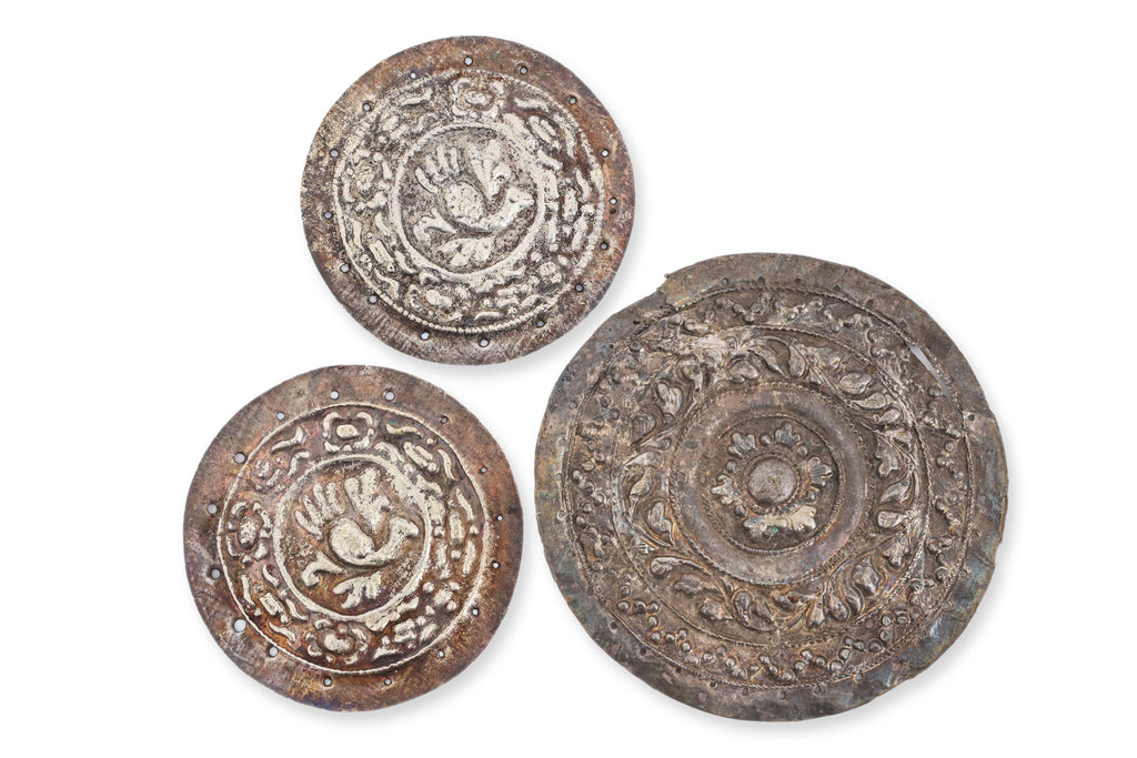 A GROUP OF SIX SILVER PILLOW AND BOLSTER ENDS