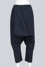 COMME DES GARCONS - A PAIR OF 2014 COTTON BLEND NAVY DROP CROTCH TROUSERS