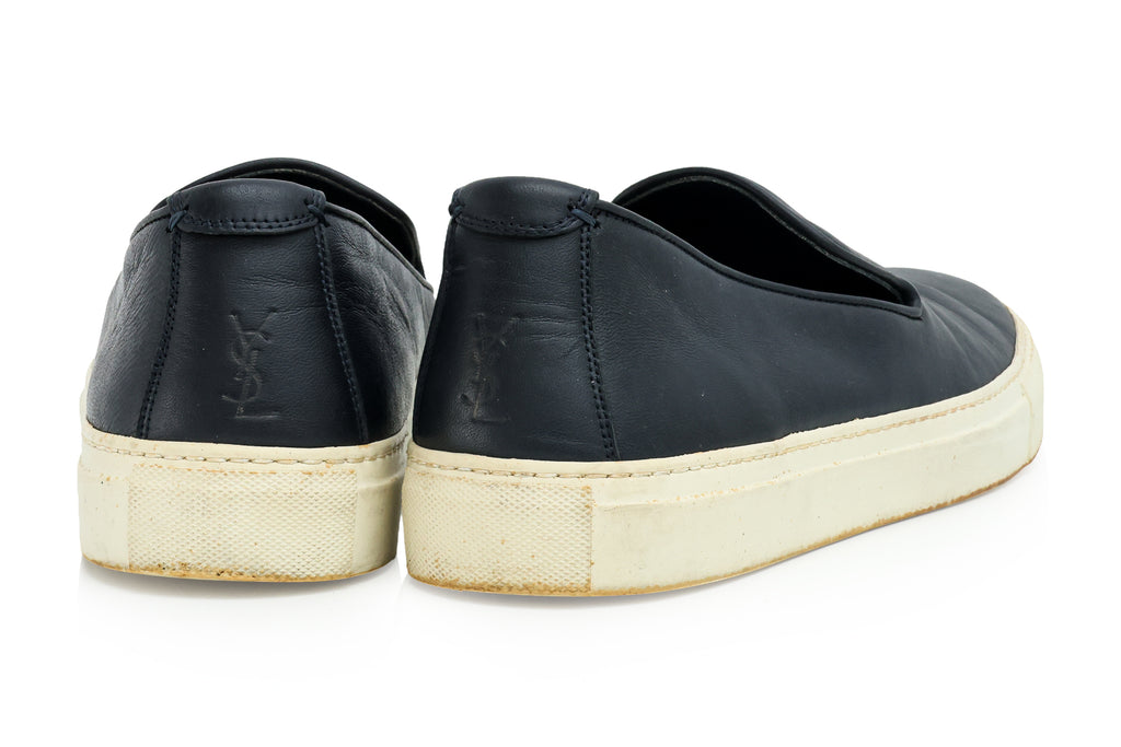 SAINT LAURENT - A PAIR OF BLACK LEATHER SLIP-ON TRAINERS