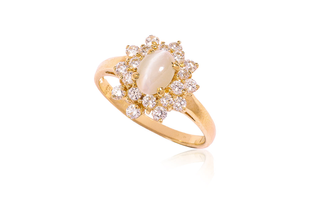 A CAT'S EYE CHRYSOBERYL AND DIAMOND RING