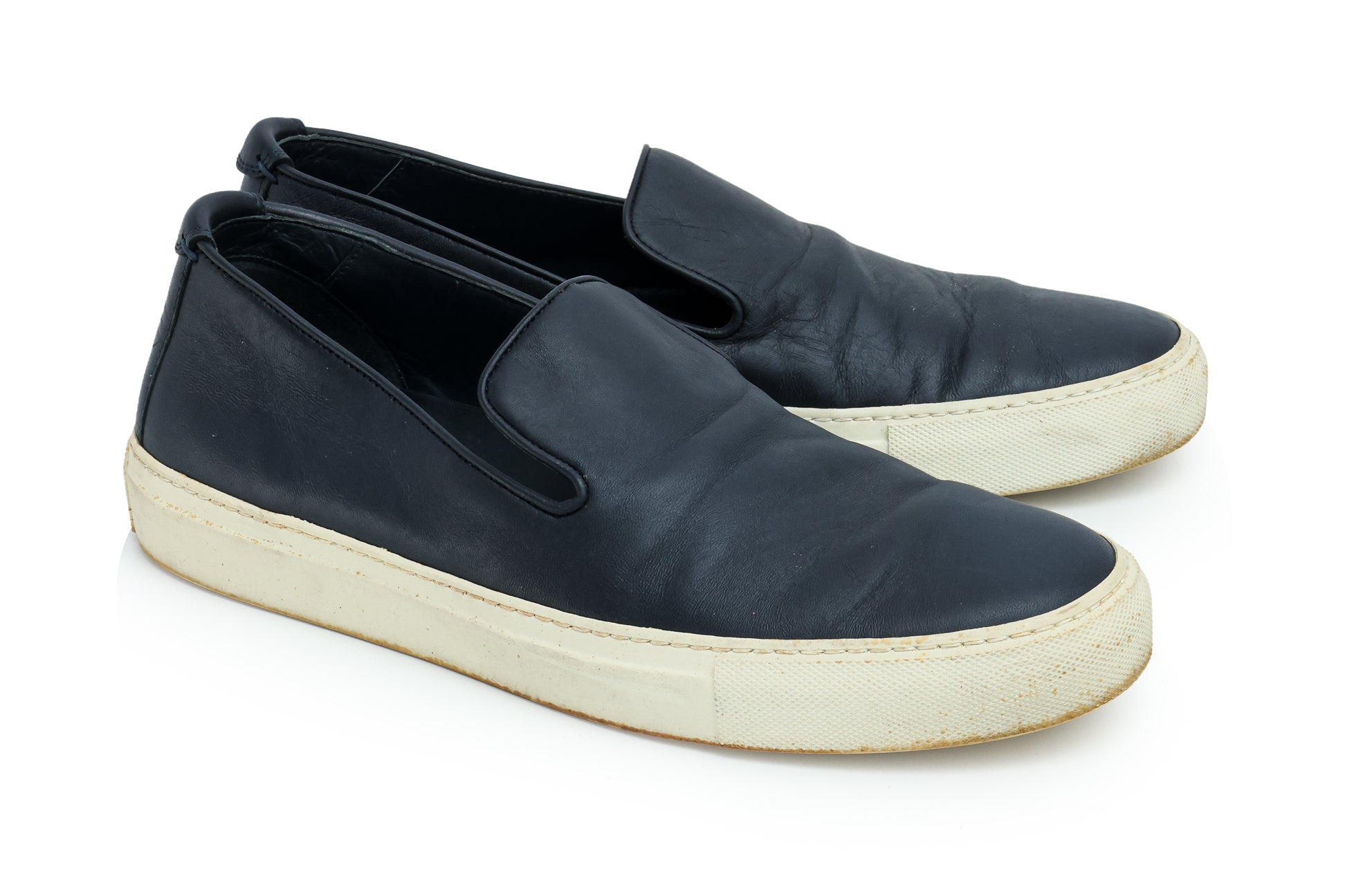 SAINT LAURENT - A PAIR OF BLACK LEATHER SLIP-ON TRAINERS