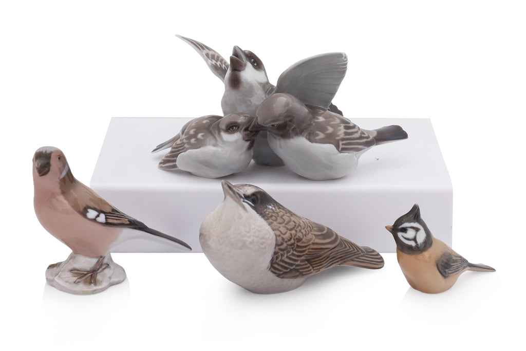 A GROUP OF FOUR ROYAL COPENHAGEN AND BING & GRONDAHL PORCELAIN BIRDS