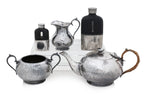 AN ENGLISH SILVER PLATED THREE PIECE TEA SERVICE AND TWO HIP FLASKS