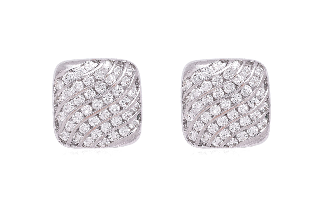 A PAIR OF CHANNEL SET DIAMOND 'WAVE' STUD EARRINGS