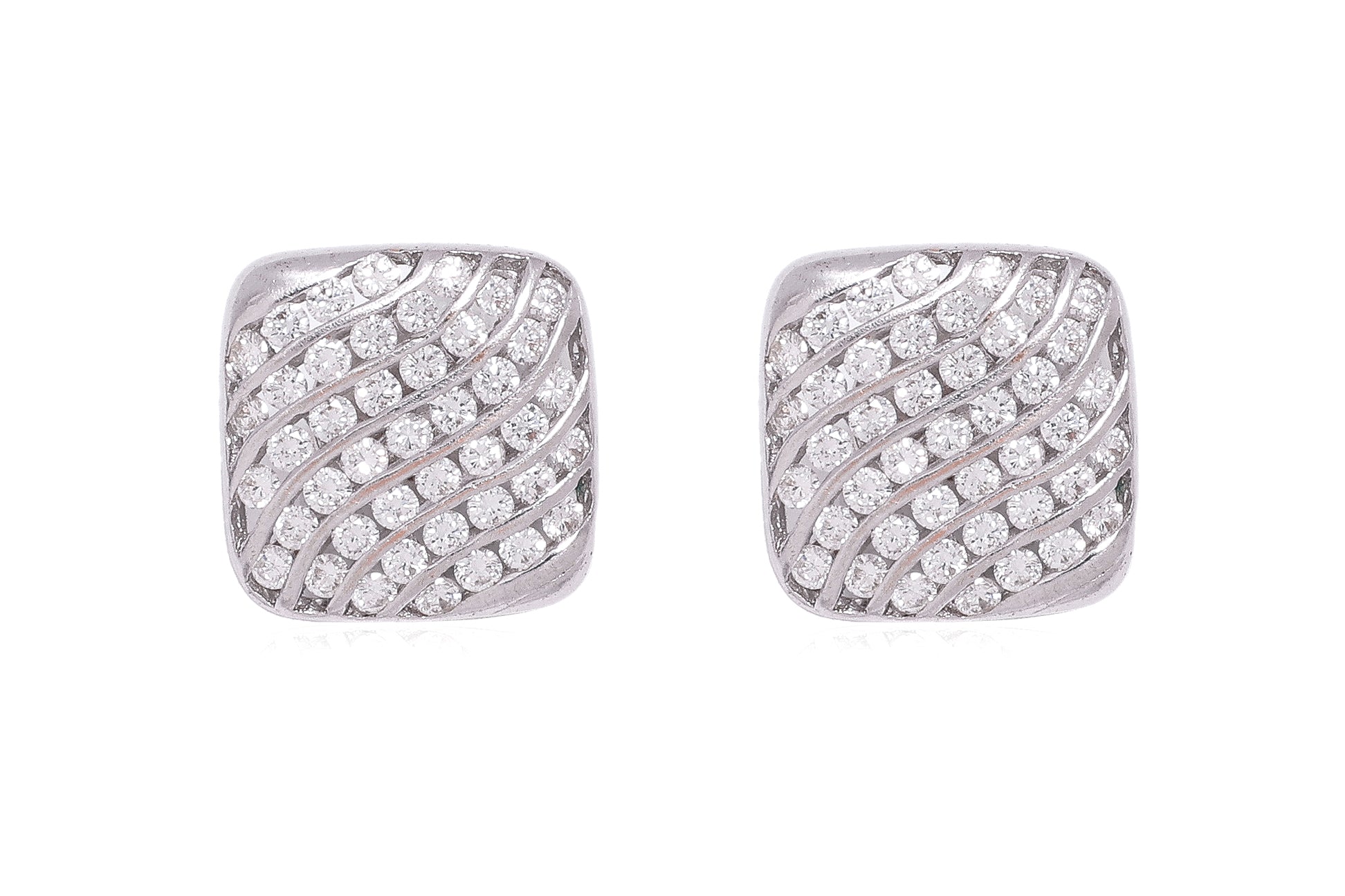 A PAIR OF CHANNEL SET DIAMOND 'WAVE' STUD EARRINGS