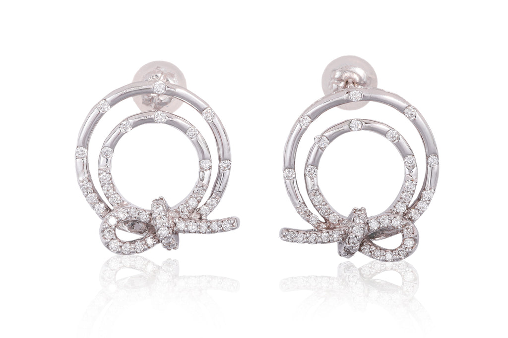 A PAIR OF DIAMOND SET CIRCULAR 'KNOT' EARRINGS