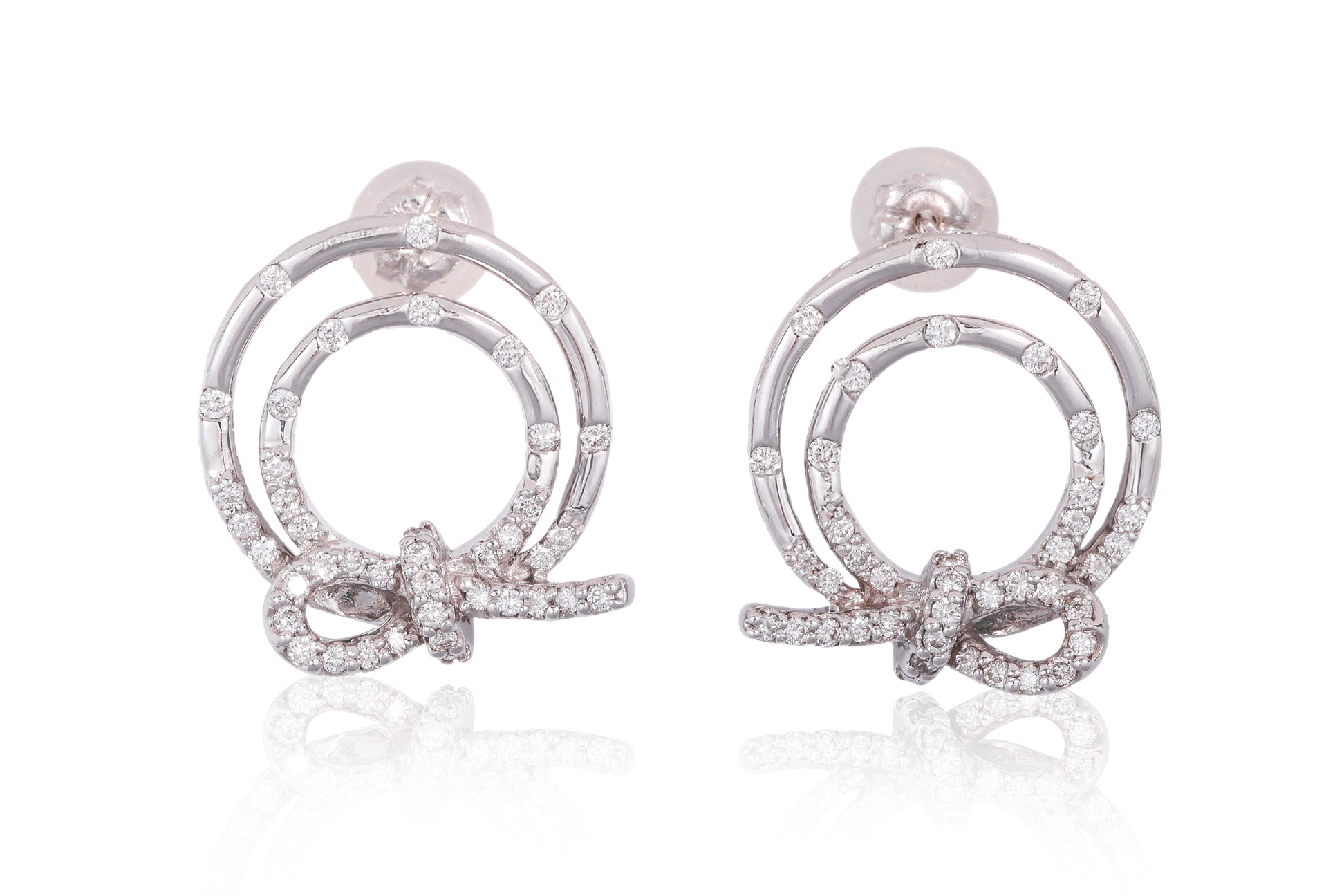 A PAIR OF DIAMOND SET CIRCULAR 'KNOT' EARRINGS