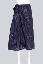 Y'S YOHJI YAMAMOTO - A PURPLE FLORAL WRAP SKIRT WITH BLUE METALLIC PRINT ACCENTS