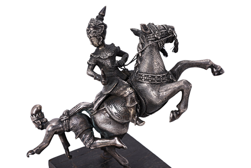 A BURMESE WHITE METAL MODEL OF FIGURES ON HORSEBACK