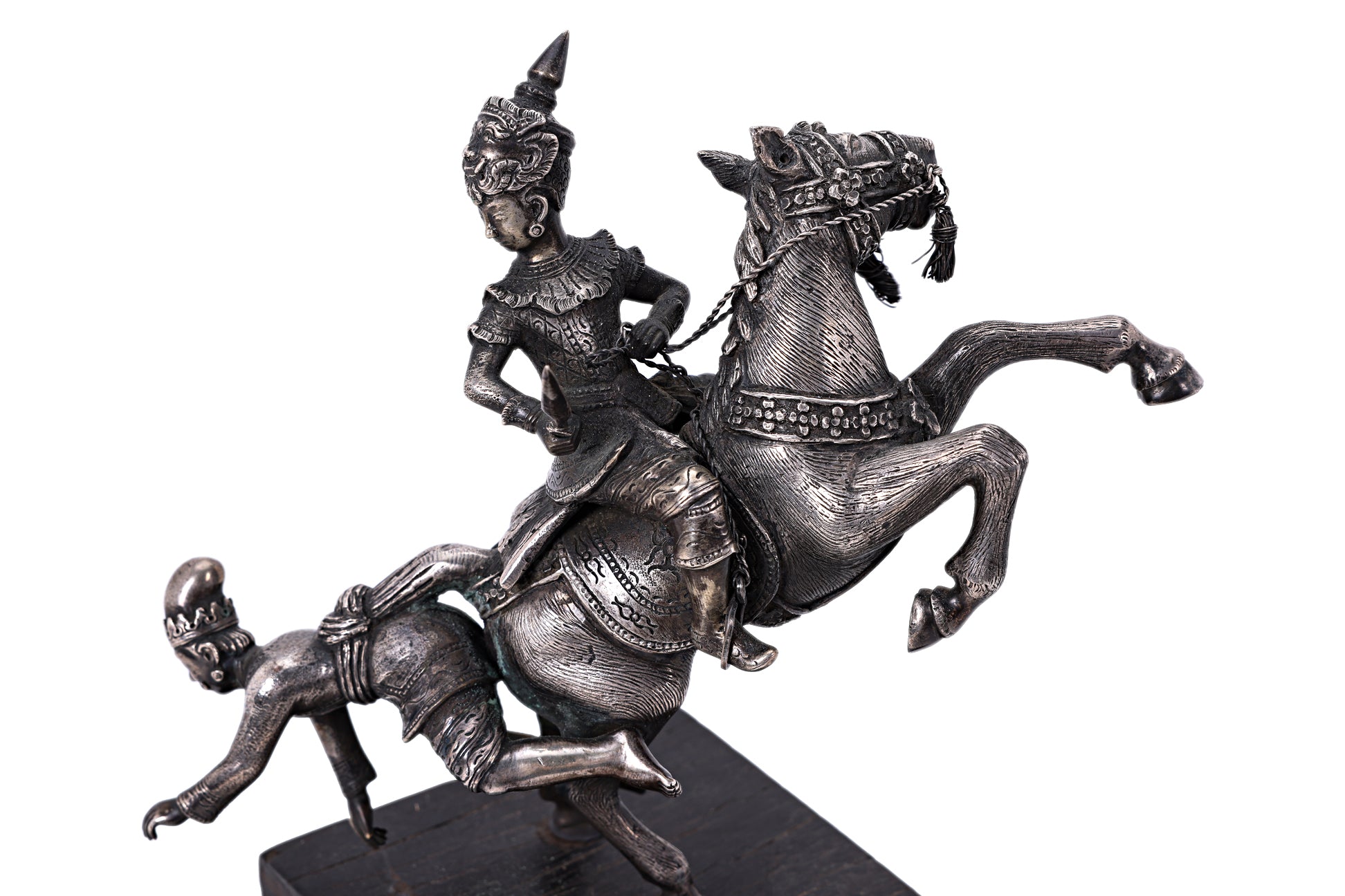 A BURMESE WHITE METAL MODEL OF FIGURES ON HORSEBACK
