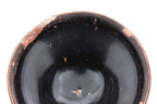 A BLACK-GLAZED STONEWARE BOWL
