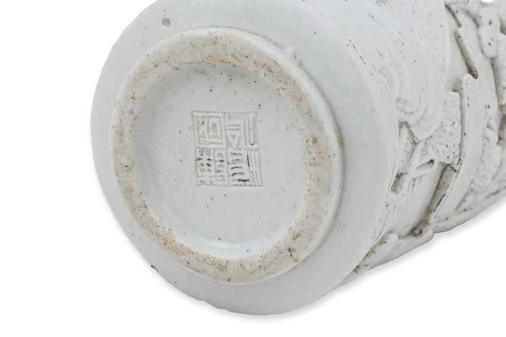 A SMALL WHITE GLAZED PORCELAIN BOTTLE