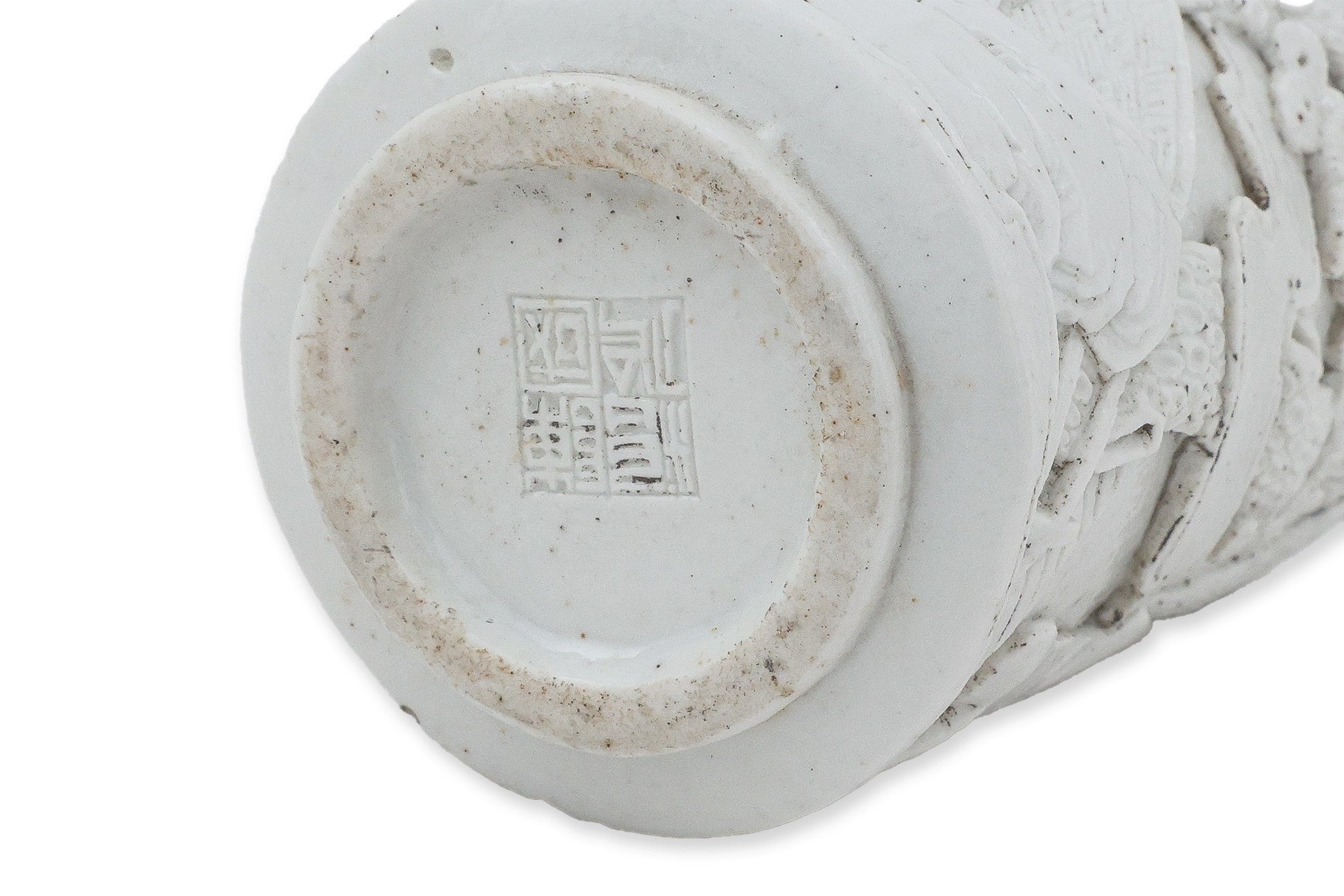 A SMALL WHITE GLAZED PORCELAIN BOTTLE
