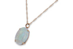 A LARGE OPAL PENDANT/BROOCH ON A CHAIN