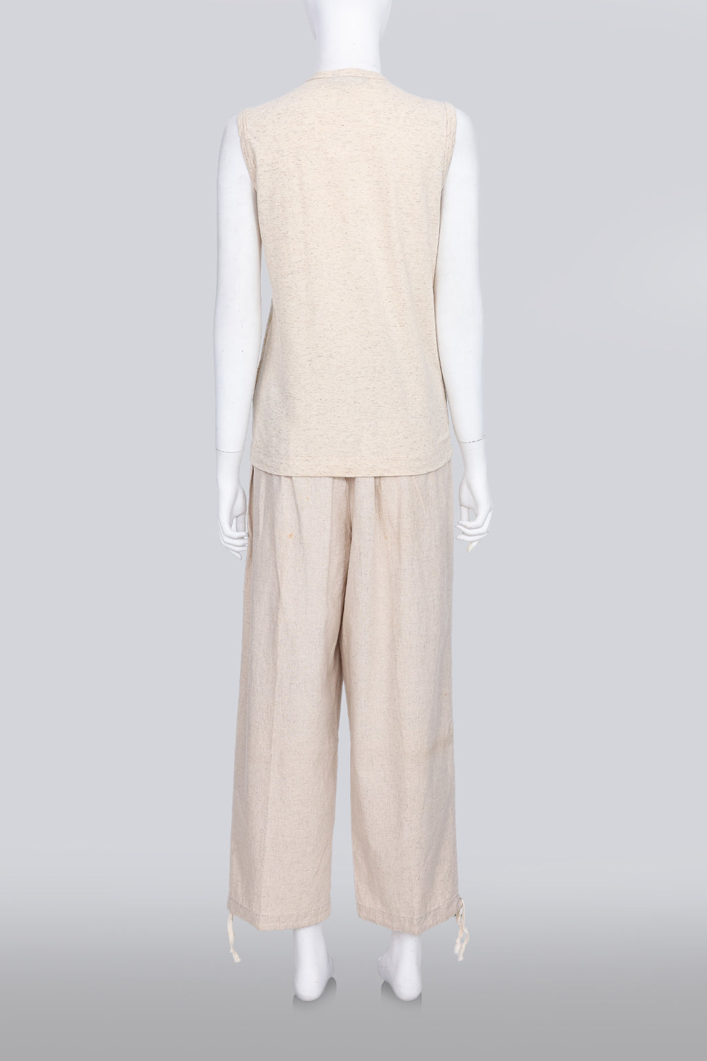 COMME DES GARCONS TRICOT - A 2007 SLEEVELESS TAN GOLD EMBROIDERED SHIRT AND TAN TROUSERS ENSEMBLE