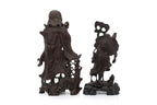 A SOAPSTONE AND A HARDWOOD CARVED FIGURE OF A MONK